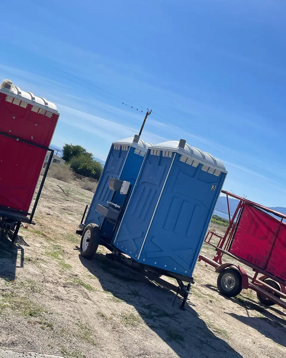 Porta potties loaded on a small towable trailer